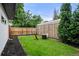Backyard featuring a lush lawn, new fence, mulch, and outdoor seating - ideal for relaxation at 1518 S Columbine St, Denver, CO 80210
