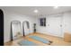 Finished basement with natural light and mirrors, perfect for a home gym, yoga, or recreational space at 1518 S Columbine St, Denver, CO 80210