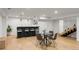 Finished basement offers a bar with seating and a dining area perfect for entertaining Gathering and guests at 1518 S Columbine St, Denver, CO 80210