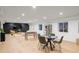 Large finished basement with multiple areas for entertaining, including a bar, dining, and seating areas at 1518 S Columbine St, Denver, CO 80210