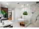 Bright bathroom with a soaking tub, walk-in shower, and modern vanity at 1518 S Columbine St, Denver, CO 80210