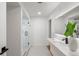 Sleek bathroom features a glass-enclosed shower, contemporary vanity, and modern fixtures throughout at 1518 S Columbine St, Denver, CO 80210