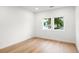 Bright bedroom features hardwood floors, base trim and two large windows allowing natural light at 1518 S Columbine St, Denver, CO 80210