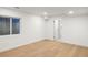 Bright bedroom with hardwood floors and a window offering natural light into the spacious room at 1518 S Columbine St, Denver, CO 80210