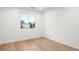 Bright bedroom features hardwood floors, base trim and a large window allowing natural light at 1518 S Columbine St, Denver, CO 80210