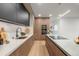 Sleek, modern kitchen with stainless steel appliances, light wood cabinets, and island at 1518 S Columbine St, Denver, CO 80210