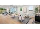 Bright, modern living room with large windows, stylish seating, and a unique glass wine display at 1518 S Columbine St, Denver, CO 80210