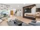 Spacious living room featuring a glass wine display, modern fireplace, and open floor plan at 1518 S Columbine St, Denver, CO 80210