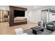 Open-concept living space with a stylish fireplace, modern seating, and built-in bar with glass display cases at 1518 S Columbine St, Denver, CO 80210