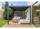 Inviting outdoor patio with a modern pergola, comfortable seating, and a wood deck at 1518 S Columbine St, Denver, CO 80210