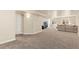 Finished basement featuring recessed lighting, comfortable seating, and an egress window at 6739 Blue Spruce St, Frederick, CO 80530