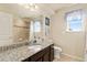 Bathroom featuring a granite countertop, shower, and tile flooring at 6739 Blue Spruce St, Frederick, CO 80530