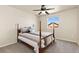 Bedroom featuring a ceiling fan, plush carpet, and great natural light from the window at 6739 Blue Spruce St, Frederick, CO 80530