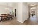 Elegant hallway with hardwood floors and access to a dining room and office space at 6739 Blue Spruce St, Frederick, CO 80530