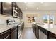 Modern kitchen with stainless steel appliances and granite countertops at 6739 Blue Spruce St, Frederick, CO 80530