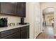 Well-appointed kitchen with dark cabinets and granite countertops, with stainless appliances at 6739 Blue Spruce St, Frederick, CO 80530