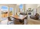 Inviting living room featuring a fireplace, high ceilings, and lots of natural light at 6739 Blue Spruce St, Frederick, CO 80530