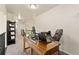 Bright office space with desk, chair and view of the upstairs hallway at 6739 Blue Spruce St, Frederick, CO 80530