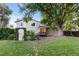 Spacious backyard with a patio, a grill, and mature trees surrounding the home at 3458 S Norfolk Way, Aurora, CO 80013