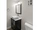 Modern bathroom featuring a vessel sink, chrome faucet, and vanity storage at 3458 S Norfolk Way, Aurora, CO 80013