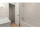 Bathroom with updated vanity and shower/bath, open door leads to walk-in closet at 3458 S Norfolk Way, Aurora, CO 80013