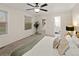 Spacious bedroom with carpet, a ceiling fan, and a window that provides natural light at 3458 S Norfolk Way, Aurora, CO 80013