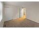 Bright bedroom featuring neutral carpeting and closet with double doors at 3458 S Norfolk Way, Aurora, CO 80013