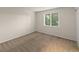 Cozy bedroom with neutral carpeting and window with bright natural light at 3458 S Norfolk Way, Aurora, CO 80013