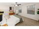 Bright bedroom featuring two windows, plush carpet, and neutral tones at 3458 S Norfolk Way, Aurora, CO 80013