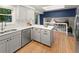 Bright eat-in kitchen features stainless steel appliances and access to the living room at 3458 S Norfolk Way, Aurora, CO 80013