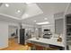 Spacious kitchen with grey cabinets, a large skylight, and stainless steel appliances at 3458 S Norfolk Way, Aurora, CO 80013