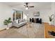 Cozy living room featuring comfortable seating and lots of natural light at 3458 S Norfolk Way, Aurora, CO 80013