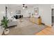 Bright living room featuring neutral tones, stylish furnishings, and hardwood trim at 3458 S Norfolk Way, Aurora, CO 80013