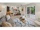 Inviting living room with access to the kitchen and backyard with a neutral color palette at 3458 S Norfolk Way, Aurora, CO 80013