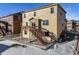 Elevated deck and patio with stairs leading to a fenced backyard at 6044 Point Rider Cir, Castle Rock, CO 80104
