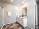 Updated bathroom with double vanity and a large walk-in shower at 6044 Point Rider Cir, Castle Rock, CO 80104