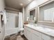Bathroom with a bathtub, double vanity, and updated flooring at 6044 Point Rider Cir, Castle Rock, CO 80104