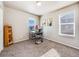 Bright bedroom featuring a built-in desk and bookshelf at 6044 Point Rider Cir, Castle Rock, CO 80104