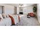 Main bedroom with cozy seating area and neutral wall colors at 6044 Point Rider Cir, Castle Rock, CO 80104