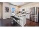Modern kitchen with stainless steel appliances and granite countertops at 6044 Point Rider Cir, Castle Rock, CO 80104