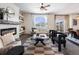 Open living space with fireplace, seating, and view of dining area at 6044 Point Rider Cir, Castle Rock, CO 80104