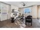 Living room with a fireplace, comfy seating, and a large window at 6044 Point Rider Cir, Castle Rock, CO 80104