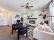Spacious living room featuring a fireplace and large windows at 6044 Point Rider Cir, Castle Rock, CO 80104