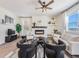 Living room with a fireplace, seating area, and large windows at 6044 Point Rider Cir, Castle Rock, CO 80104