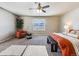 Spacious main bedroom with large window, ceiling fan, and plush carpet at 6044 Point Rider Cir, Castle Rock, CO 80104