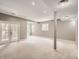 Spacious finished basement with carpet flooring and access to the backyard through glass doors at 625 Kendall Way, Lakewood, CO 80214