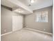 Neutral-toned basement bedroom featuring a window, closet, and plush carpeting for a cozy atmosphere at 625 Kendall Way, Lakewood, CO 80214