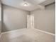 Carpeted basement with white trim, neutral paint, and a closet space at 625 Kendall Way, Lakewood, CO 80214