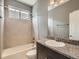 Bathroom featuring tub shower combo and vanity at 625 Kendall Way, Lakewood, CO 80214