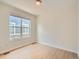 Bright bedroom features a window providing natural light and hardwood flooring at 625 Kendall Way, Lakewood, CO 80214